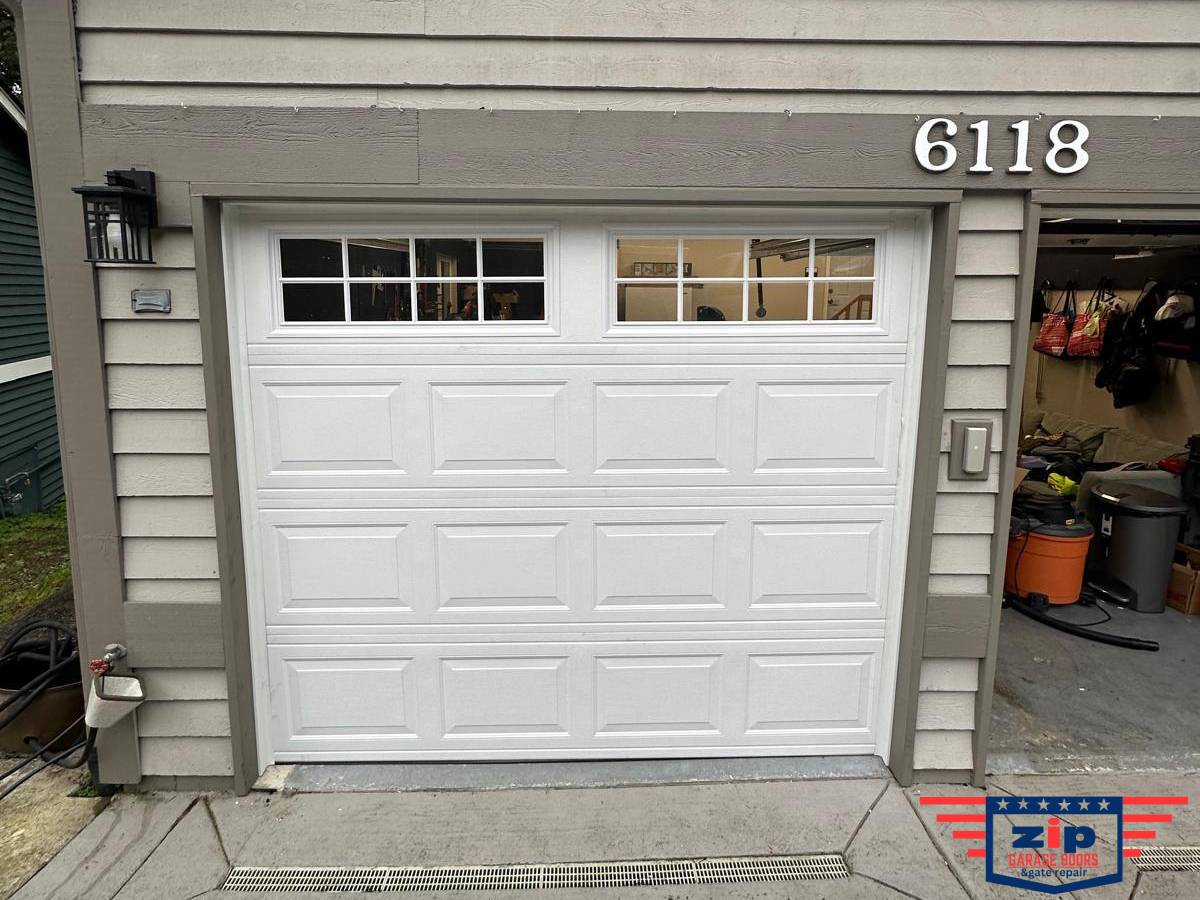 <i>New garage door installed with upgraded windows and flawless alignment.</i>